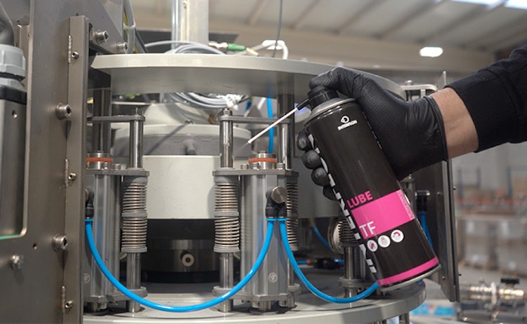 Aplicación de lubricante seco en spray Interflon Lube TF sobre columnas máquina